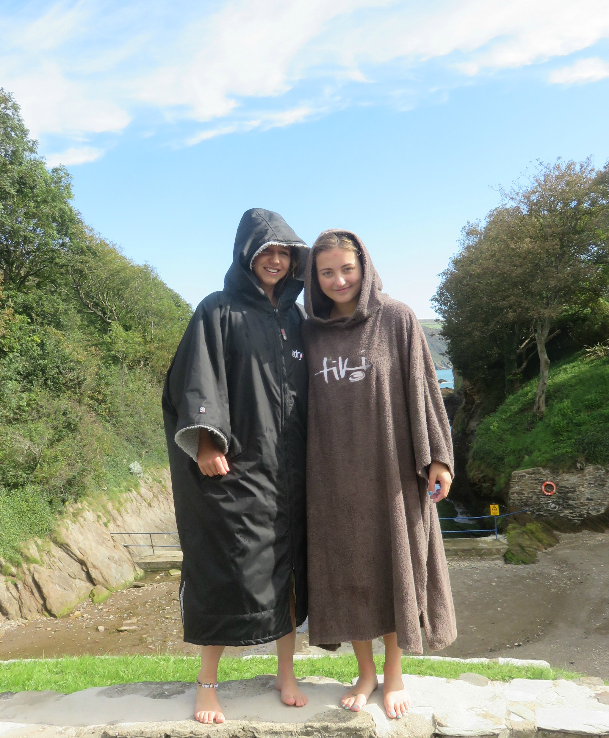 Couple wearing different colour dryrobes
