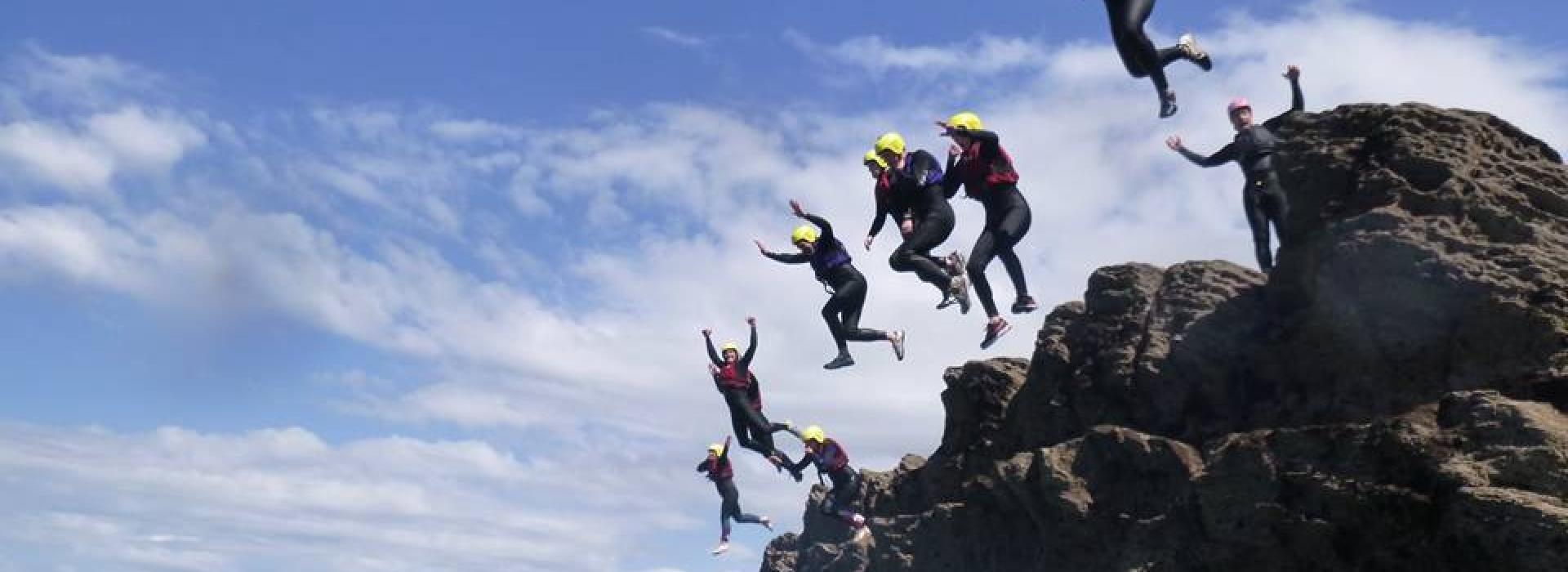 groups jumping off a cliff near Ilfracombe