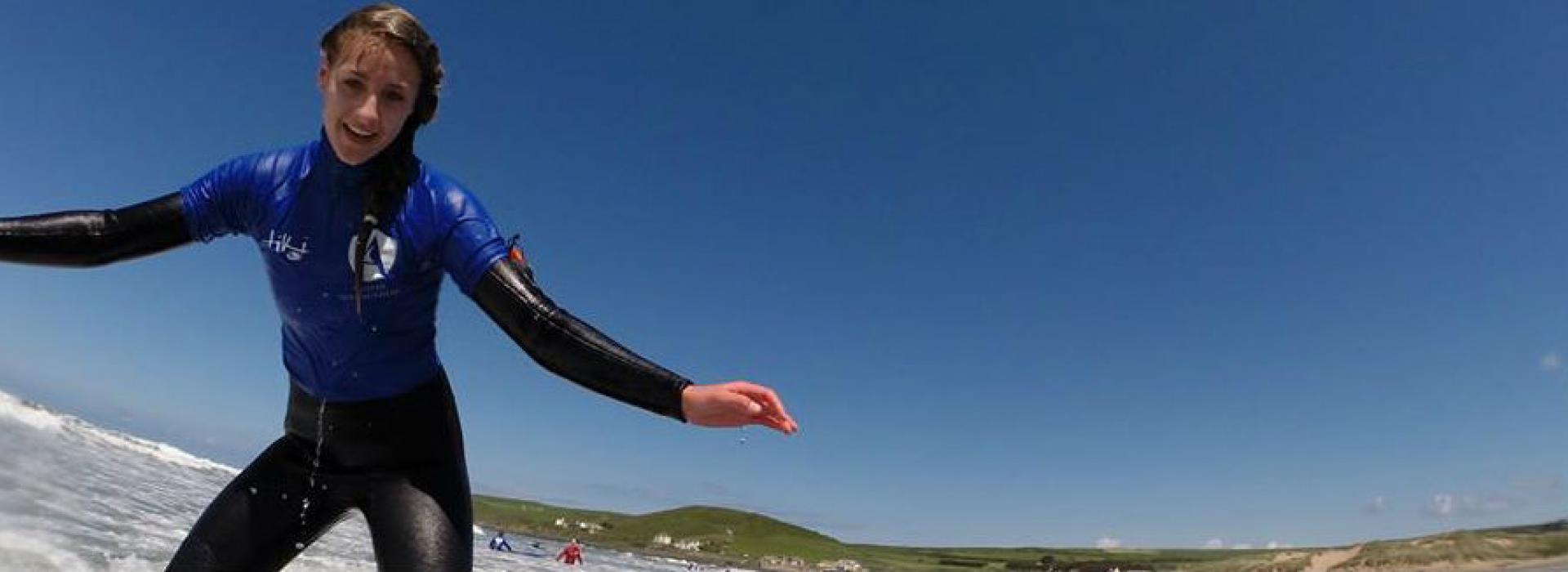 learning to surf on a wave in North Devon