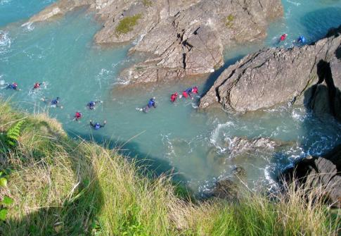 coasteering group on North Devon rocks